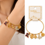 Pulsera Dorada con Dijes de Mariposas y Flores