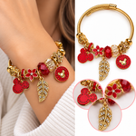 Pulsera Dorada con Charms Rojos y Hoja Brillante